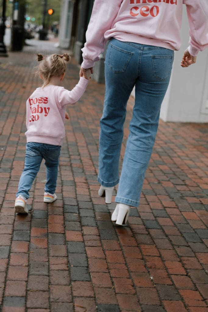 Ashley walking with her daughter at time of starting her business while working full time